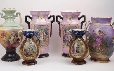 A group of ceramic vases, 19th and 20th centuries, to include a pair of Victorian twin handled vases, of pink ground decorated with a cartouche containing scenes of a wedding and a christening, with black twin handles and bases, each 40cm high, a...