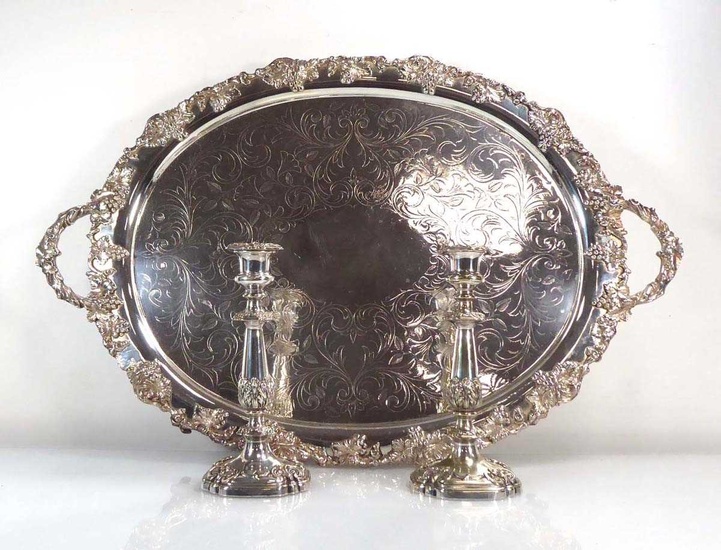 A large silver plated two handled tray of oval form...