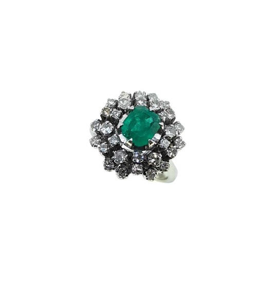A late 20th century emerald and diamond cluster ring