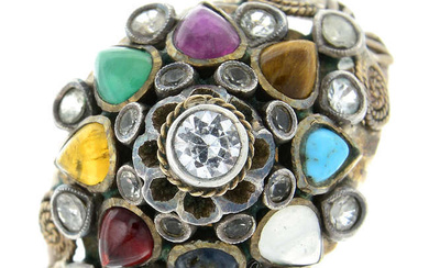 A multi-gem dress ring.