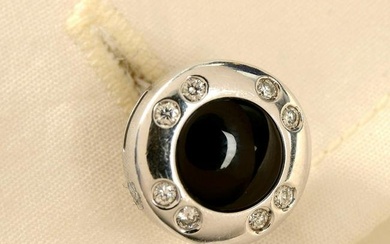 A pair of 18ct gold onyx and brilliant-cut diamond cufflinks.Estimated total diamond weight 0.30ct