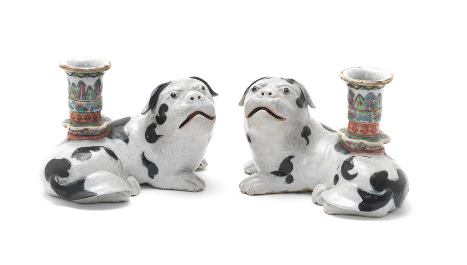 A pair of Chinese Export porcelain 'pug dog' candle holders