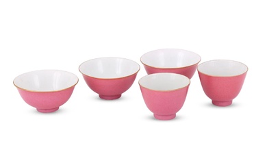 A pair of Chinese ruby-red glazed wine cups and three bowls