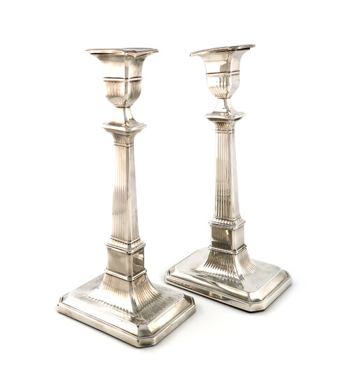 A pair of George III silver candlesticks