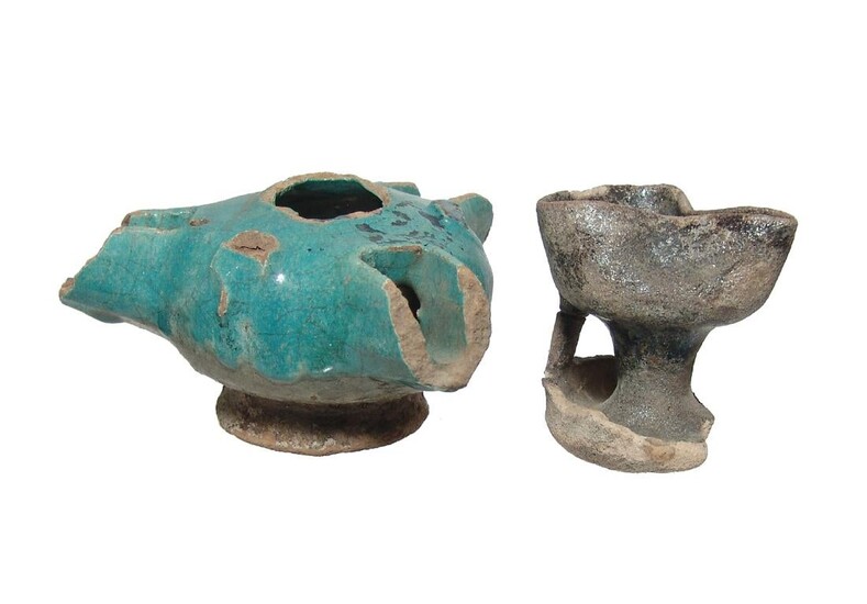 A pair of Islamic turquoise-glazed lamps