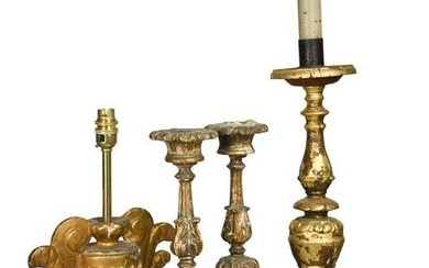 A pair of Italian carved wood and gilded altar sticks, 18th century