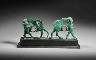 A pair of Luristan bronze horsebit cheekpieces, 9th-8th century B.C.