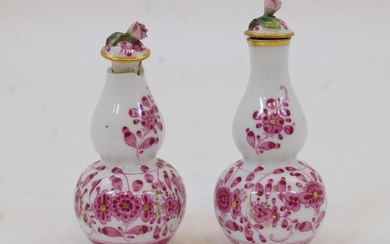 A pair of Meissen miniature double gourd vases and covers, 20th century, with encrusted pink rose finials, decorated with trailing flowers, with blue crossed swords marks to underside, 10.5cm high (2) Provenance: Works of Art from the Schroder...