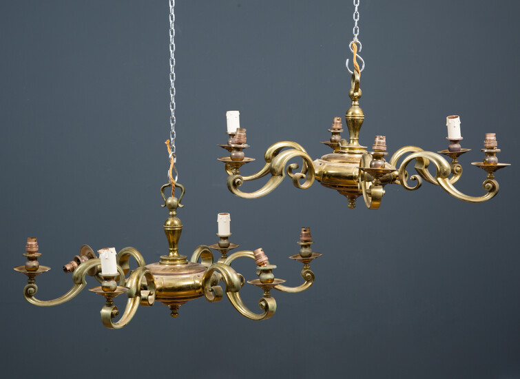 A pair of brass six branch chandeliers