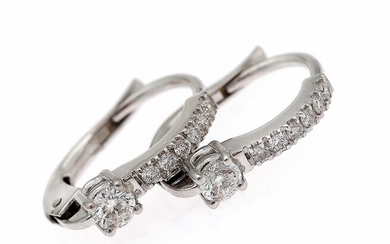 SOLD. A pair of diamond ear pendants each set with numerous diamonds weighing a total...