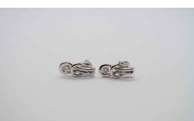 A pair of good quality 18ct white gold diamond Love Knot ear...