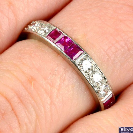 A ruby and brilliant-cut diamond full-eternity ring.