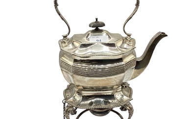 A sterling silver teapot on a sterling stand with...
