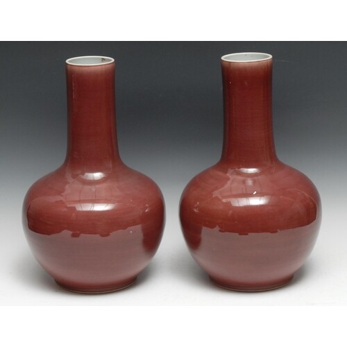A tall pair of Chinese Sang de Boeuf porcelain globular vase...