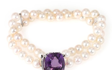 A two strand pearl bracelet set with numerous cultured pearls and an...