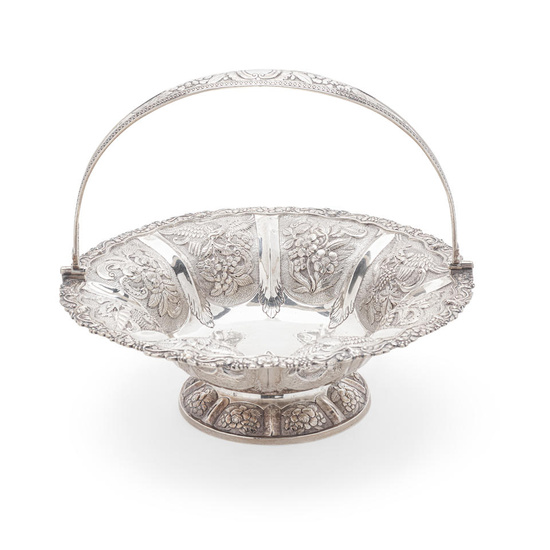 AN IRISH GEORGE III SILVER CHASSED AND REPOUSSÉ BASKET by...