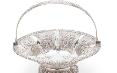 AN IRISH GEORGE III SILVER CHASSED AND REPOUSSÉ BASKET by...