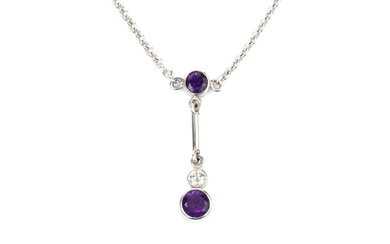 An 18ct white gold, amethyst and diamond necklace, the oval...