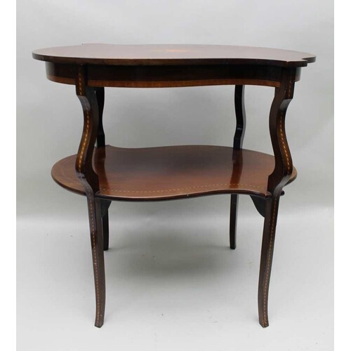 An Edwardian mahogany fancy shaped two tier occasional table...