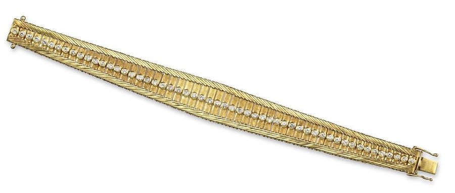 An Italian diamond-set gold bracelet, of tapered design...
