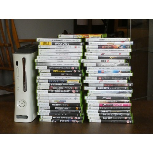 An XBOX 360 console complete with games, controllers, headph...