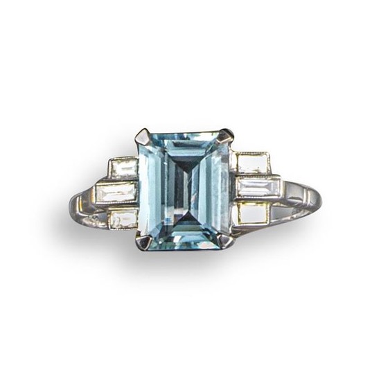 An aquamarine and diamond ring, the emerald-cut aquamarine...