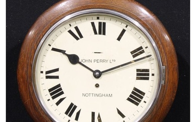 An early 20th century oak school or railway type timepiece, ...
