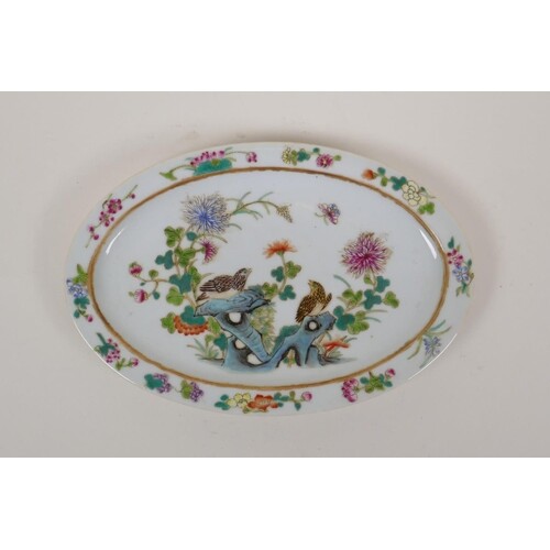 An early C20th polychrome porcelain oval dish with enamel de...