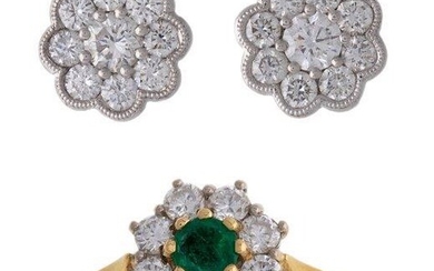 An emerald and diamond cluster ring and pair of diamond earstuds, the ring of cluster design centring on a circular-cut emerald within a surround of brilliant-cut diamonds, British hallmarks for 18-carat gold, London, ring size N, the ear studs of...