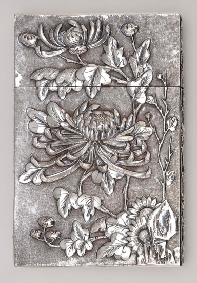 CHINESE SILVER CARD CASE Raised chrysanthemum design on one face and a figural courtyard scene on the other. Blank monogram cartouch...