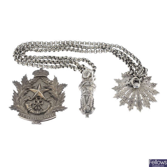 Cameronians (Scottish Rifles), a late 19th century silver breast badge with crossbelt, star, and whistle.