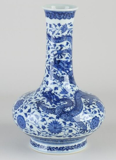 Chinese porcelain dragon vase with bottom mark.