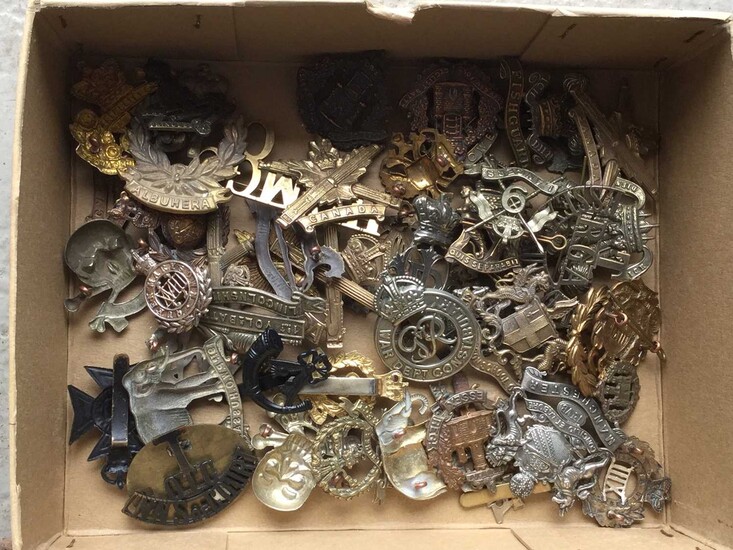 Collection of approximately 50 British Military cap badges including Machine Gun Corps, The Essex Regiment and The Royal Irish Regiment (some copies noted)