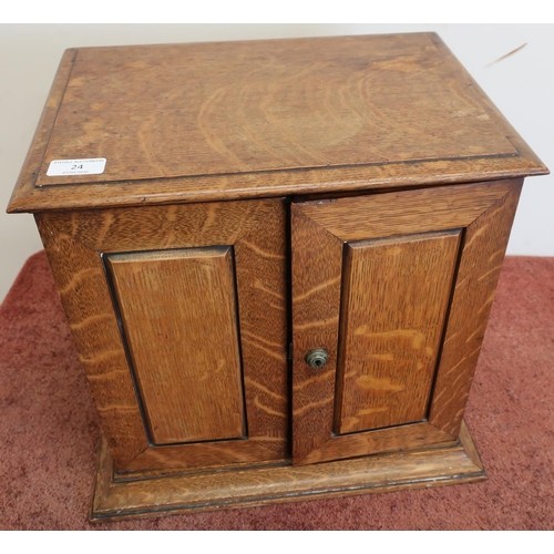 Edwardian oak table/smokers cabinet enclosed by two panelled...
