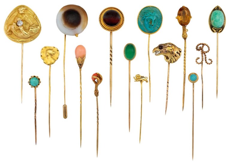 Fifteen various gem-set and hardstone stickpins, comprising: a Victorian banded agate stickpin with bead and rope work detail; a carved turquoise cameo stickpin, stamped 22ct; an Art Nouveau stickpin depicting the profile of two tigers playing with...