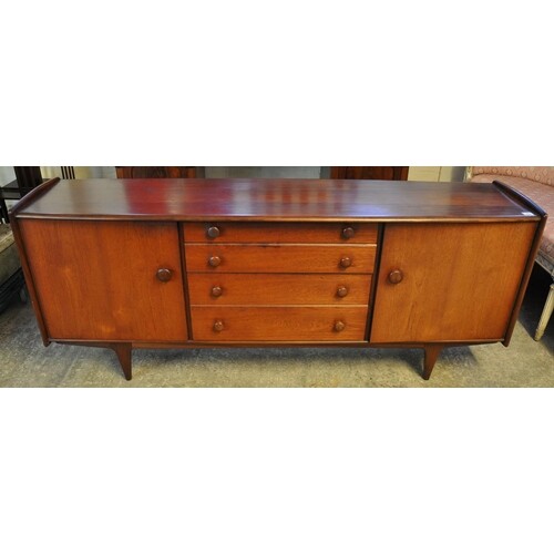 G Plan style teak sideboard, the bow front top flanked by tw...