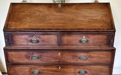 George III mahogany bureau of bold proportions, the fall-front enclosing fitted interior above two short and three long drawers, on bracket feet, 117cm wide x 56cm deep, 112cm high