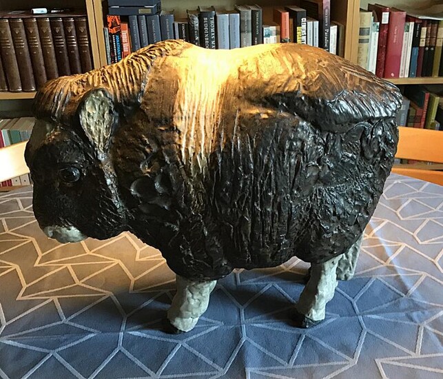 SOLD. Jeanne Grut: An earthenware figure modelled in the shape of a musk ox calf. Decorated with brown, black and white glaze. Made by Aluminia. H. 35 cm. L. 40 cm. – Bruun Rasmussen Auctioneers of Fine Art