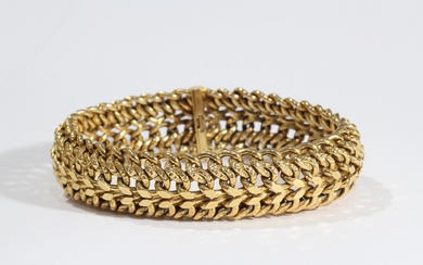 Large bracelet en or (750°°° - poinçon : Aigle) à mailles américaines avec chaîne de...
