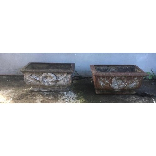 Pair of cast iron garden planters decorated with swags and w...