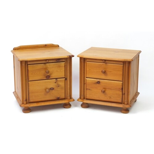 Pair of pine two drawer bedside chests with brushing slides,...