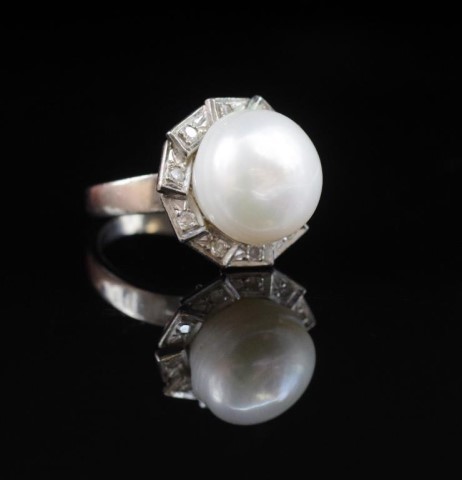 Pearl and diamond 18ct white gold halo ring marked 18ct. App...
