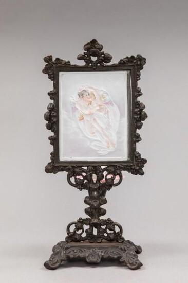 Porcelain lithophany enhanced with colors representing the love taking away Psyche. In a cast iron frame with a patina of rocaille shape. On the back a ring holds a glass bowl that can hold a candle.