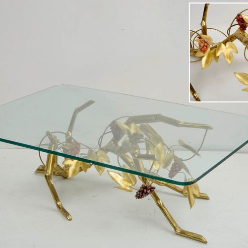 Rectangular coffee table with a brass and copper base decorated...