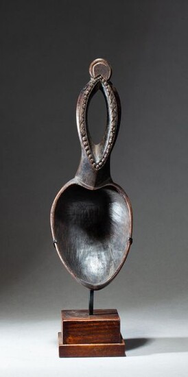 Ritual spoon, the handle carved with an openwork pattern evoking a female sex