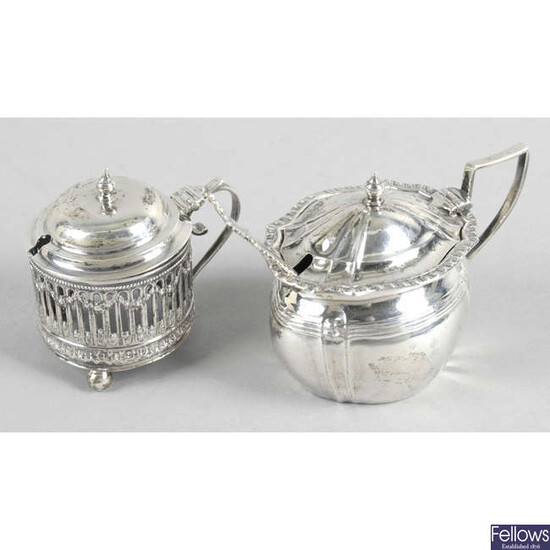 Three early 20th century silver mustard pots, together with a later example. (4).
