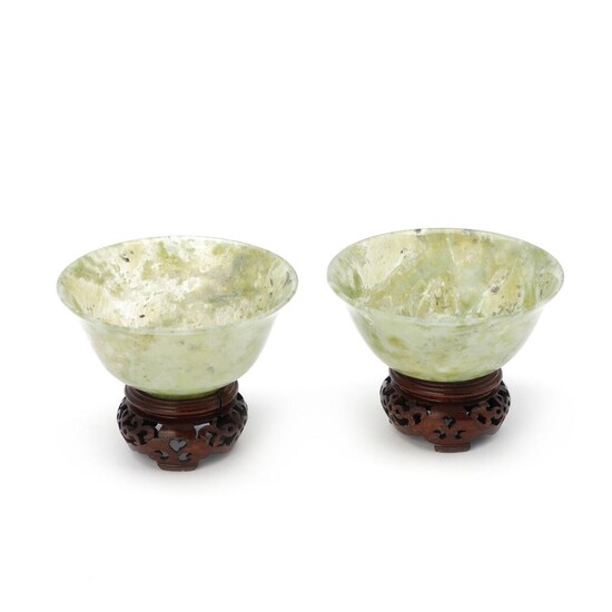 NOT SOLD. Two Chinese 20th century carved jade bowls. Diam. 10 cm. Wooden bases included. (2) – Bruun Rasmussen Auctioneers of Fine Art