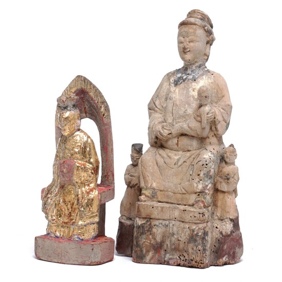Two figures of wood, one partially gilded, in the shape of Daoist God and woman with child. H. 20 and 28 cm. (2)