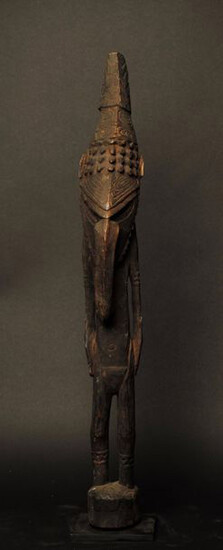 Wooden standing figure with dark patina