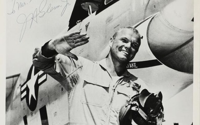 a signed b/w press photograph of the American astronaut John Glenn (1921–2016)....